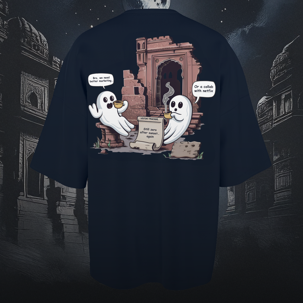 Navy blue oversized t-shirt with ghost graphic design on a dark, possibly urban background