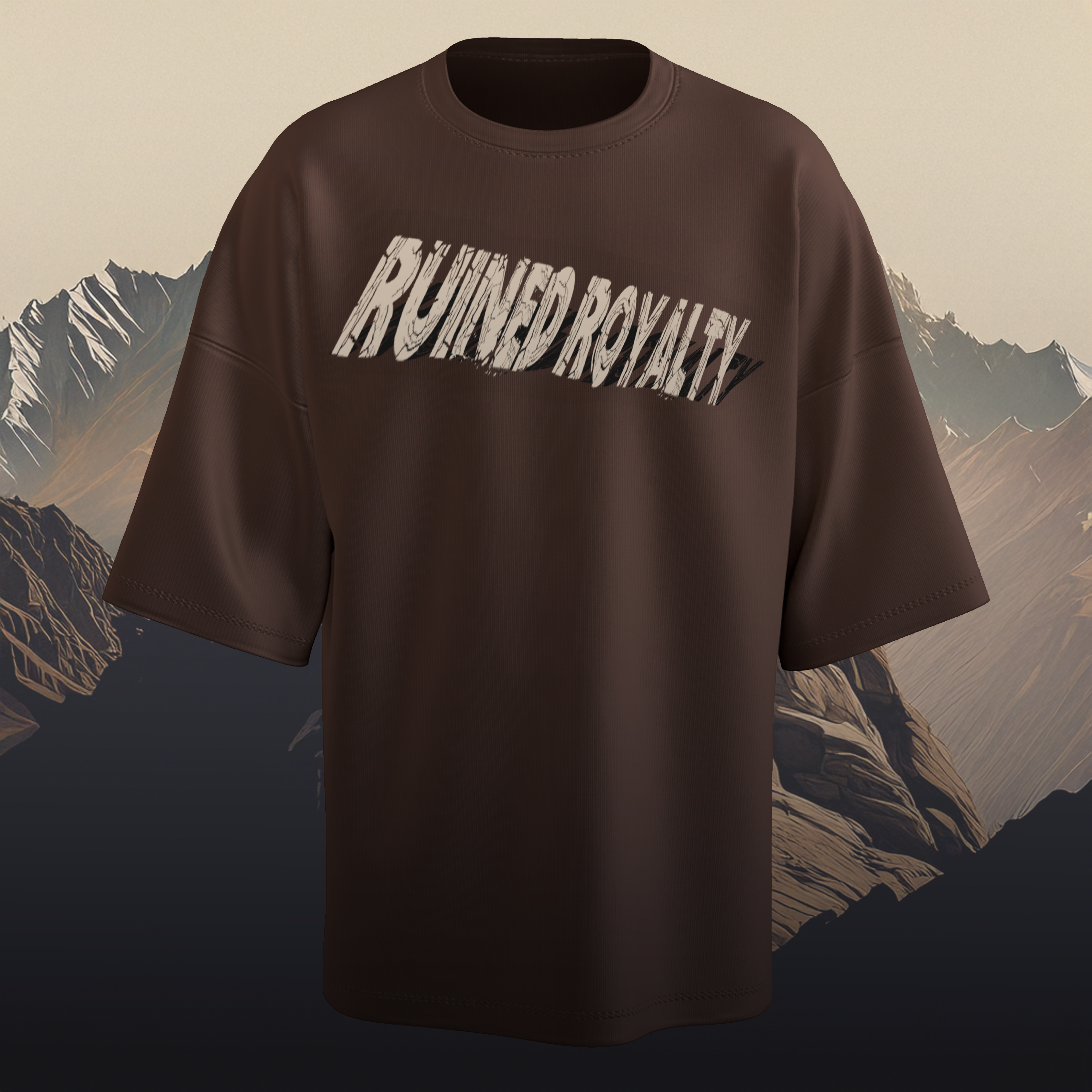 Brown oversized t-shirt with 'RUINED ROYALTY' text against a mountainous background