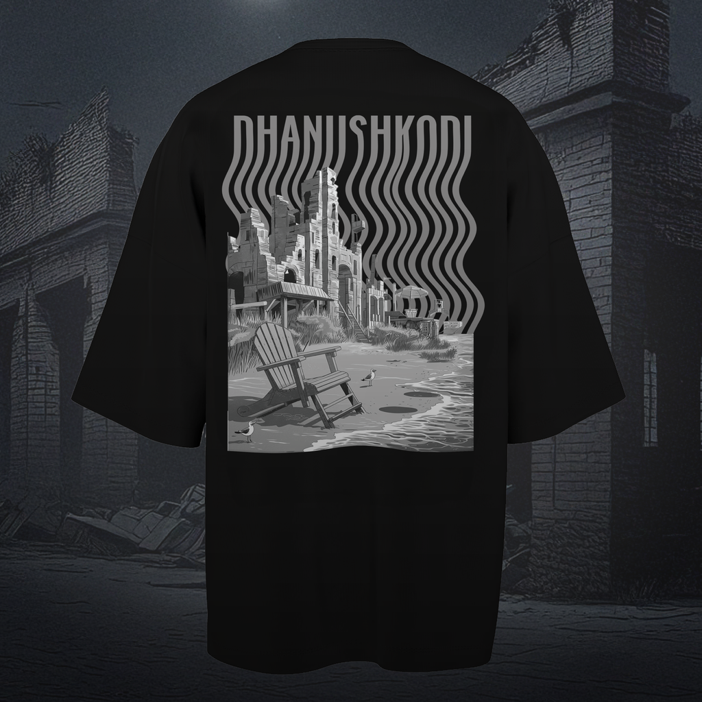 Black oversized t-shirt with a graphic design on the back, featuring a chair and text, against a dark background.