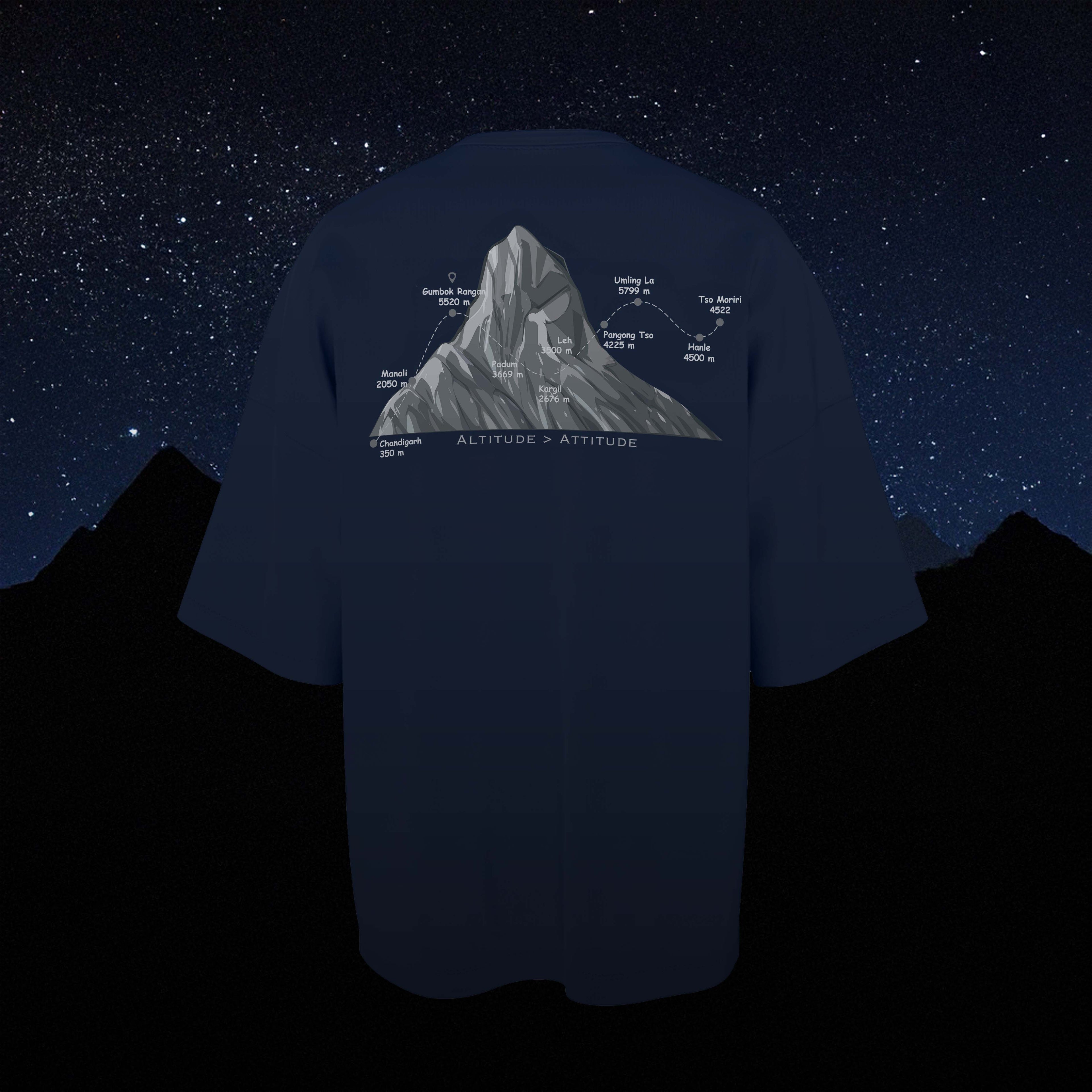 Navy blue oversized t-shirt with mountain graphic and text against a starry night sky