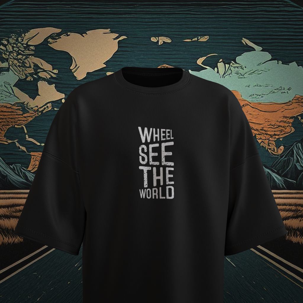 Black oversized t-shirt with 'WHEEL SEE THE WORLD' text on a world map background