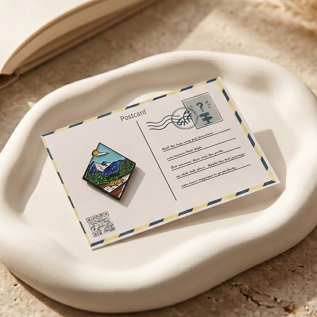 Postcard with a scenic design and QR code on a textured surface