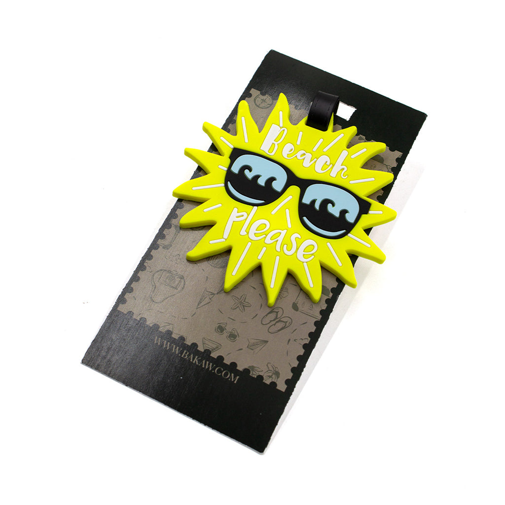 Pin with sunglasses and 'Beach Please' text on a black card