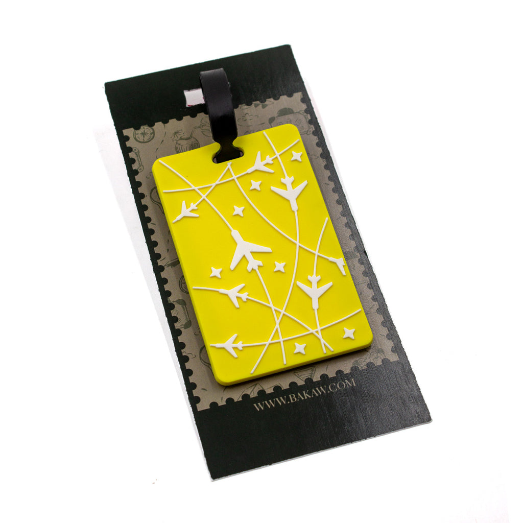 Yellow luggage tag with airplane design on a black card