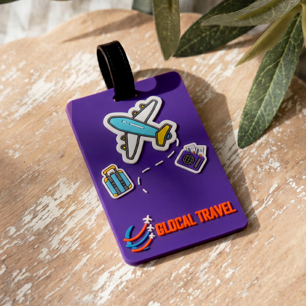 Purple luggage tag with airplane and travel icons on a wooden surface