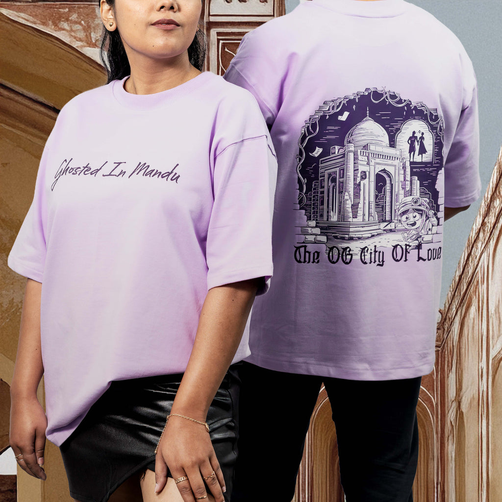 Two people wearing Mandu Lavender oversized t-shirts with text and graphics, one indoors and one outdoors.