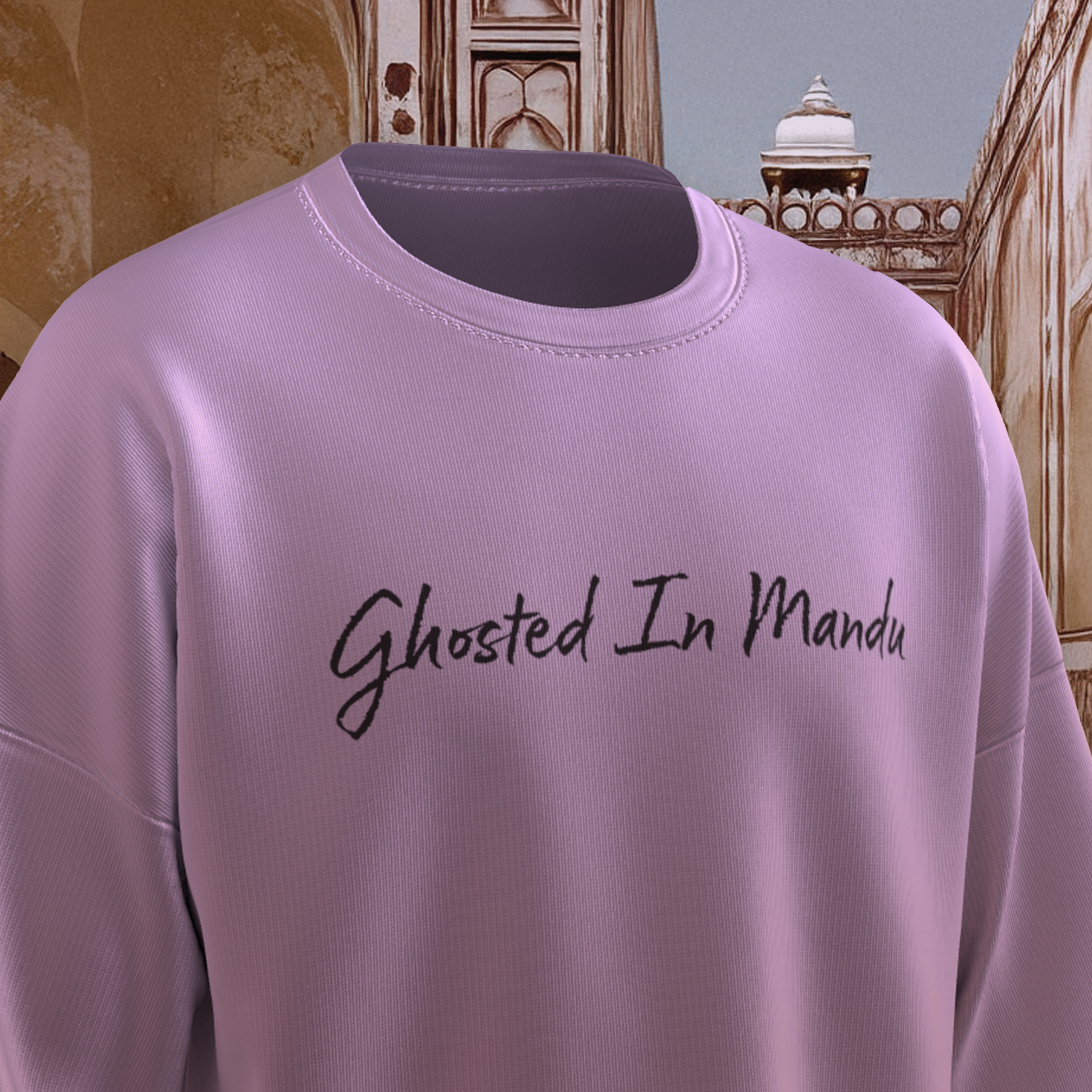 Lavender oversized  t-shirt with 'Ghosted In Mandu' text on an architectural background