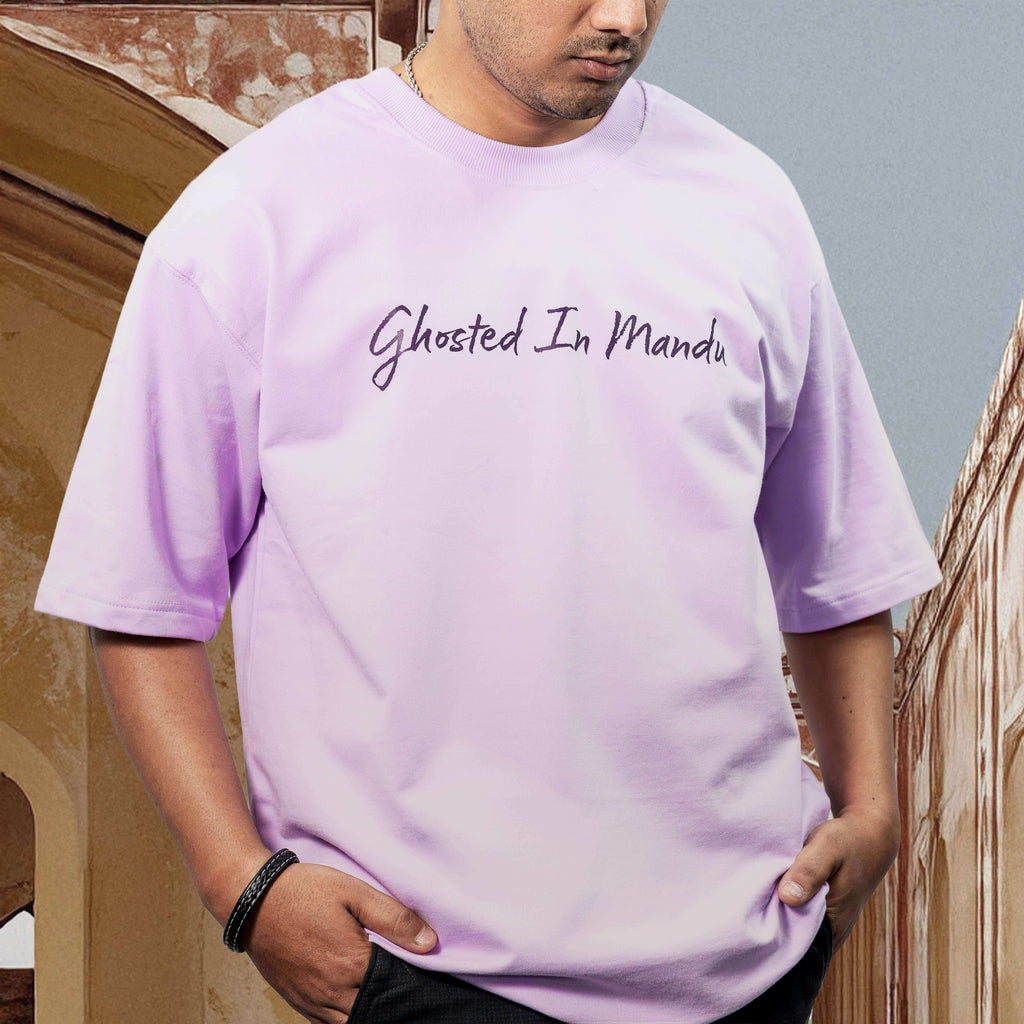 Person wearing Mandu Lavender oversized t-shirt with text standing against a neutral background