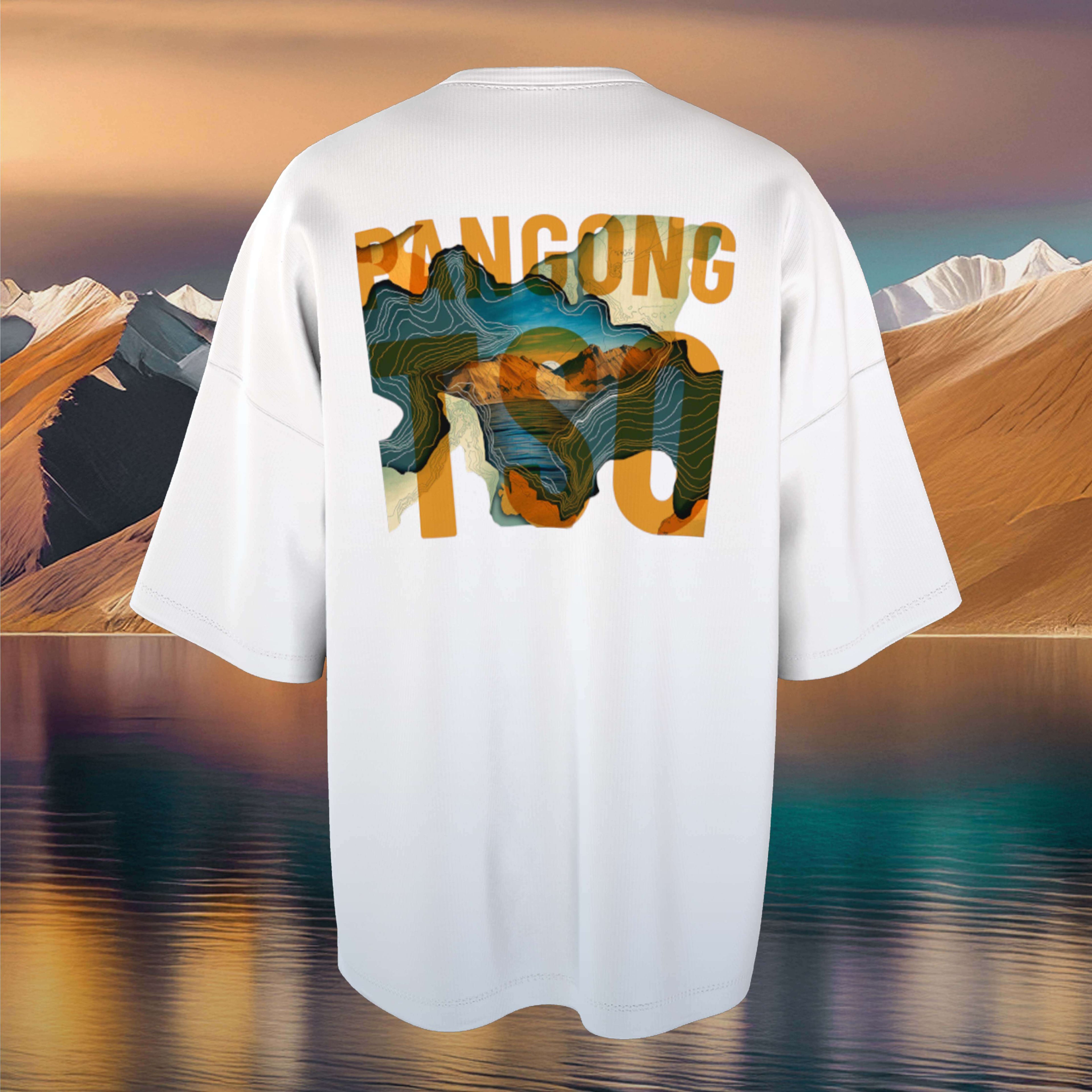 Pangong Tso White Oversized t-shirt with abstract design and text on a scenic background