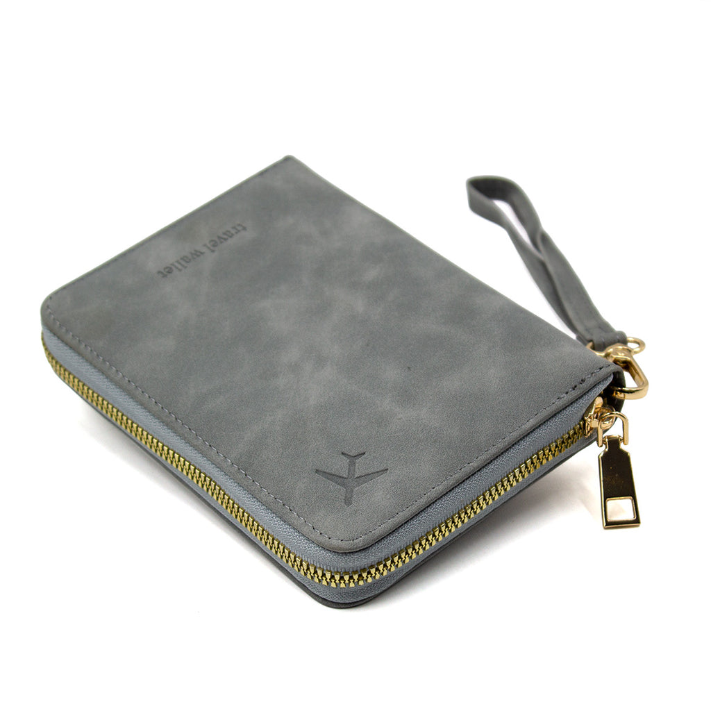 Gray wallet with gold zipper and tag on a white background