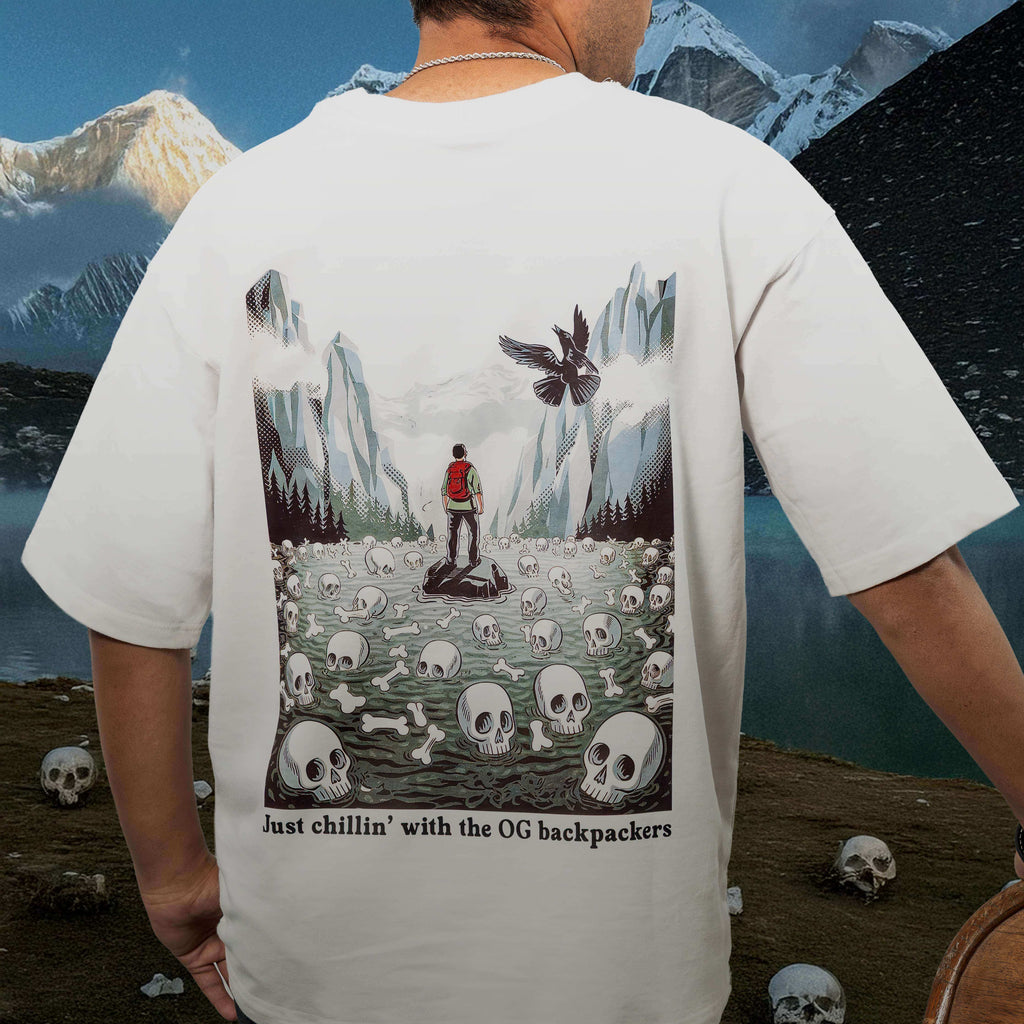 Person wearing Roopkund White Oversized t-shirt with skull and mountain graphic