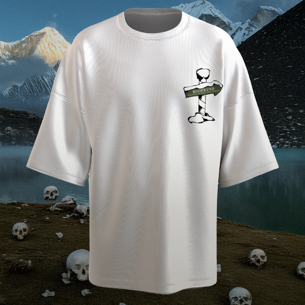 White t-shirt with a graphic design on a mountain and skull-themed background