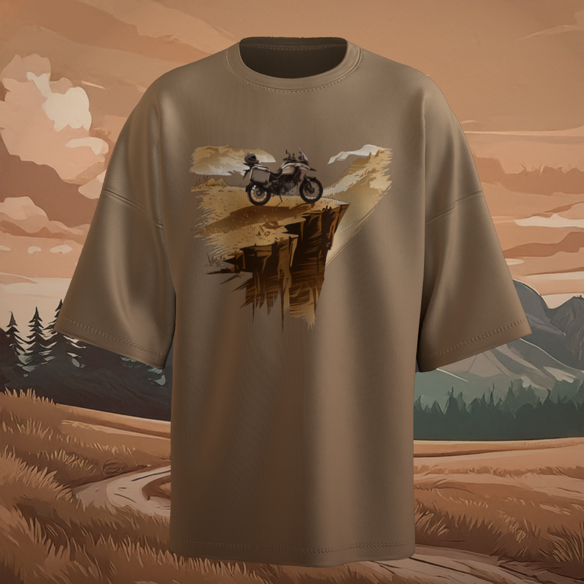 Beige oversized t-shirt with a graphic of a motorcycle on a cliff against a mountainous landscape.