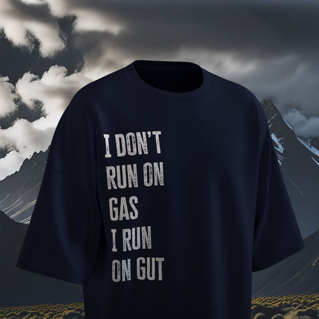 Navy blue  oversized t-shirt with motivational quote against a mountainous landscape